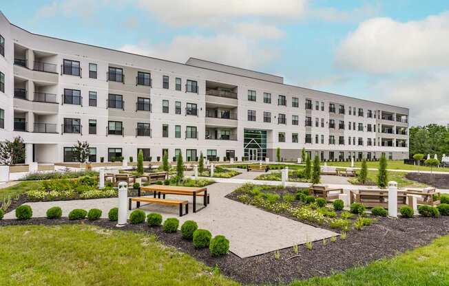 A modern building with a courtyard in front.