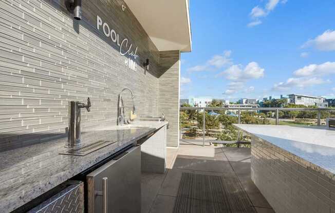 A modern pool club with a view of the pool and the city.