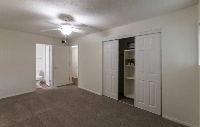 This is a photo of the primary bedroom in the 871 square foot 2 bedroom, 2 bath apartment at Princeton Court Apartments in the Vickery Meadow neighborhood of Dallas, Texas.