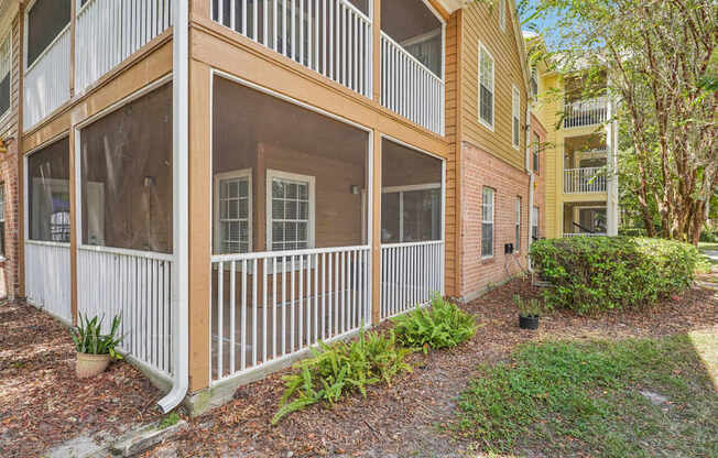 A building with a balcony and a white railing.