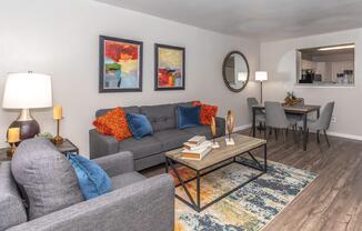 a living room filled with furniture and a fireplace