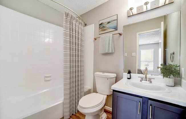 a bathroom with a toilet sink and bathtub