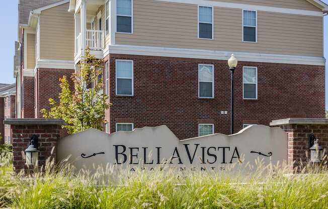the sign in front of the bella vista apartment building