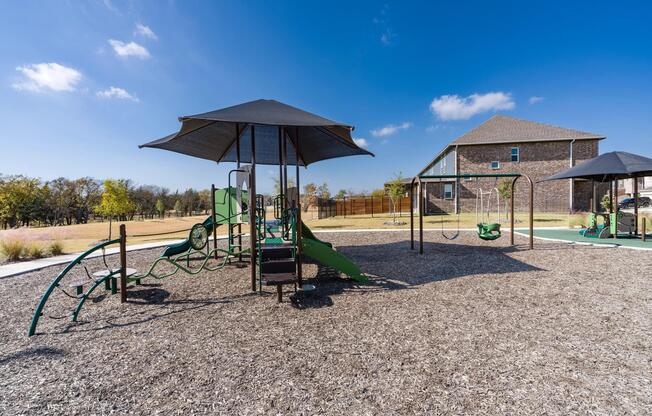 Our on-site playground features colorful play structures, a favorite spot for outdoor fun and gatherings.