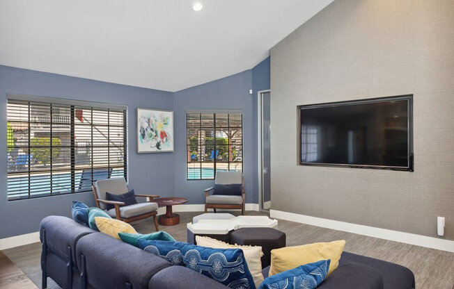 Community Clubhouse with Lounge Furniture and TV at Creek 2645 Apartments in Sacramento, CA.