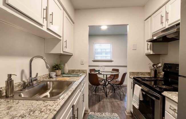 The Jaunt Apartments in Charleston South Carolina photo of kitchen with white cabinets