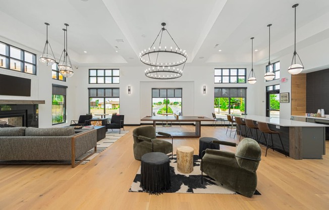 a large living room with couches and chairs and a fireplace