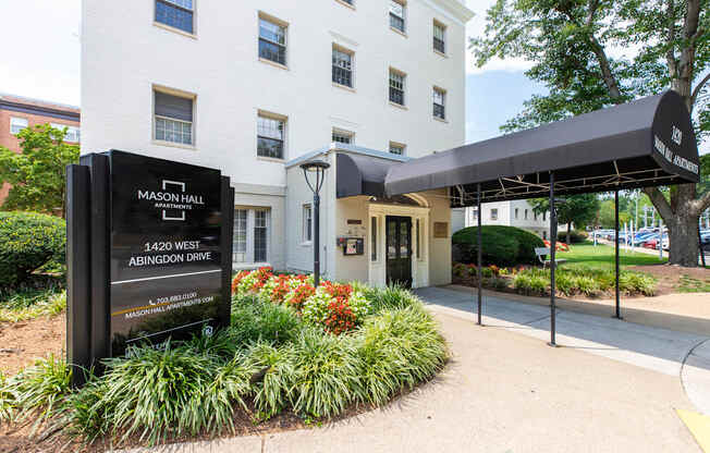 Exterior and sign at Mason Hall Apartments in Alexandria, VA 22314