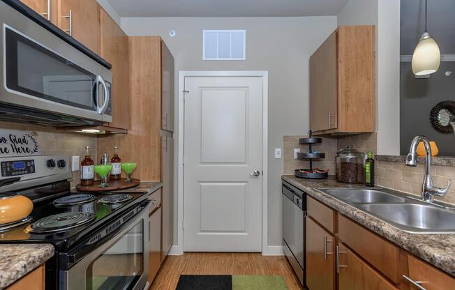 a modern kitchen with stainless steel appliances