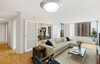 Apartment living area with den (virtually staged) at Lenox Club, Arlington, VA