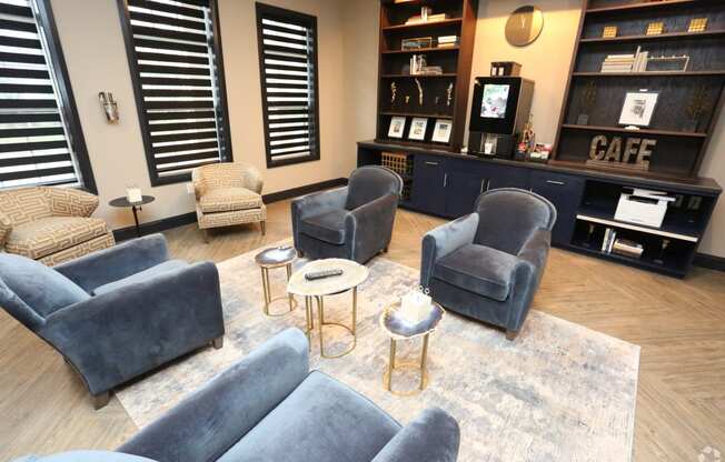 a living room with couches and chairs and a coffee table at Century Baxter Avenue, Louisville