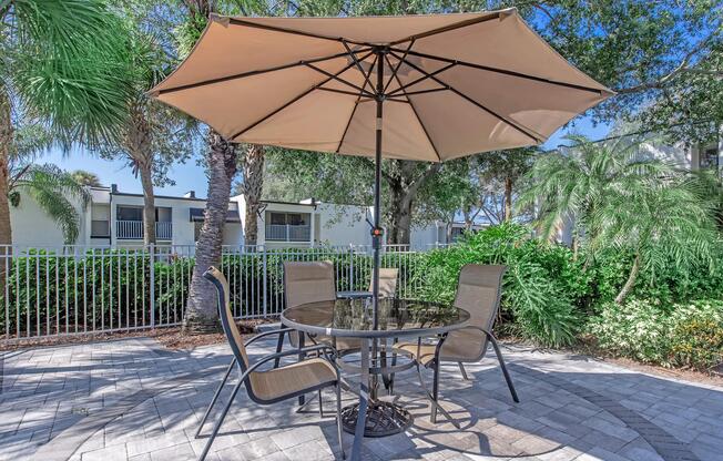 a lawn chair under an umbrella