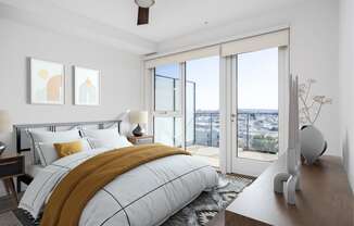 a bedroom with a bed and sliding glass doors
