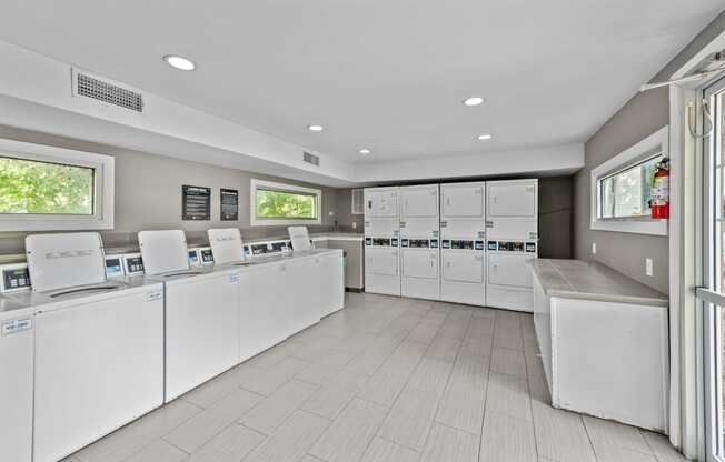 the laundry room is equipped with washers and dryers