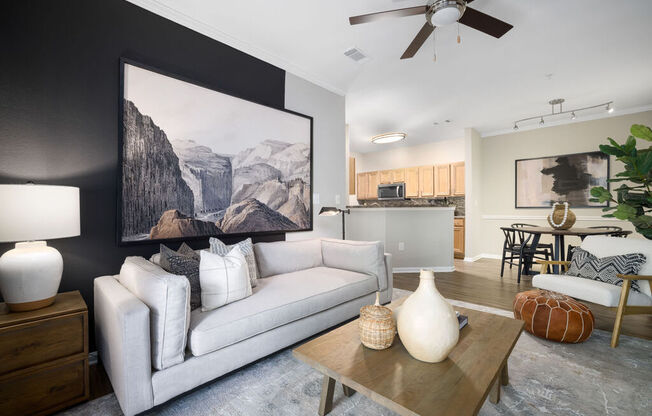 a living room with a white couch and a coffee table