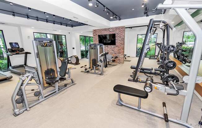 a room filled with lots of different types of exercise equipment