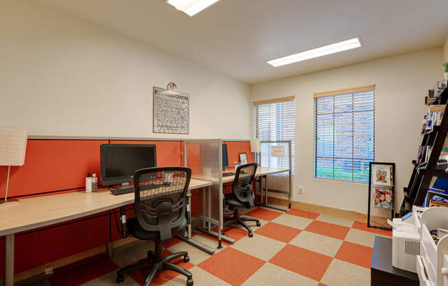 a home office with a desk and a computer