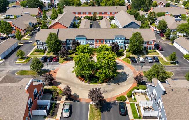 an aerial view of a neighborhood with houses and trees