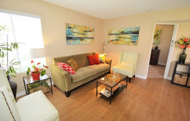 Antelope Valley CA Apartments - The Arches at Regional Center West - Living Room with Wood-Style Flooring