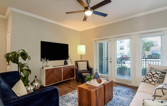 City North at Sunrise Ranch apartments living room with ceiling fan