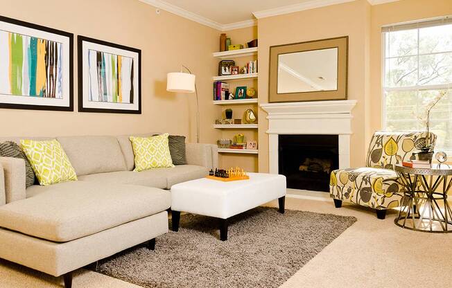 a living room with a couch coffee table and a chair