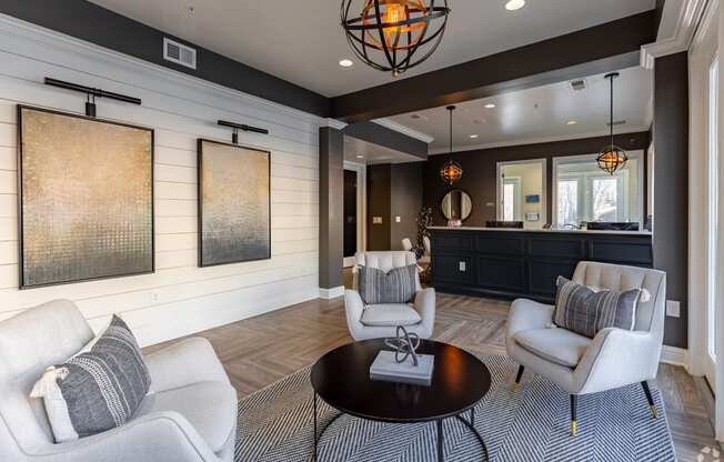 a living room with couches and chairs and a table