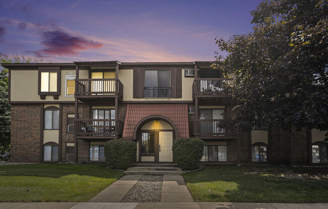 an apartment building at dusk at Apple Ridge Apartments, Michigan, 49534