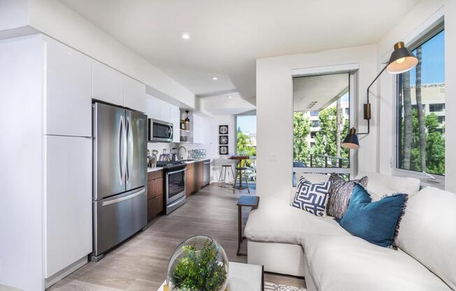 Bright kitchen with moveable island option and elegant open‑shelving design.