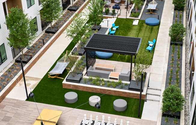 A rooftop patio with a chess board and a black and white checkerboard.