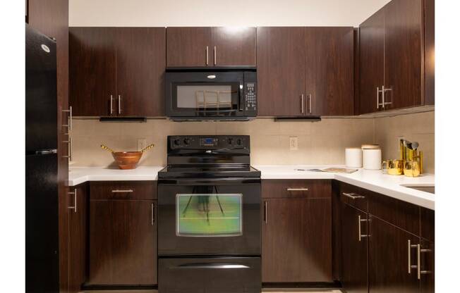 a kitchen with custom cabinetry at The Core apartments