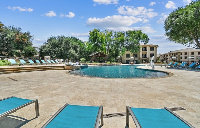 Pool With Relaxing Chairs at The Canyons Apartments, Fort Worth, TX, 76116
