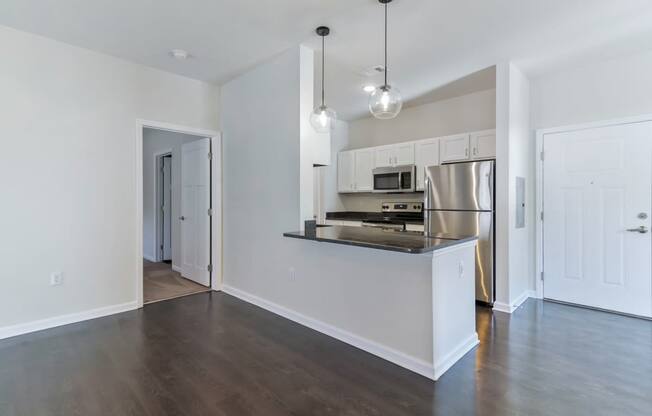 Ashland Farms Open Kitchen Layout with Island, Modern Light Fixtures, and Quartz Counters