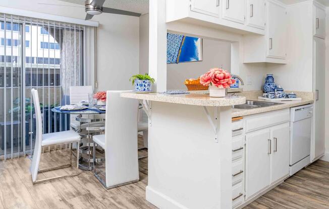 a kitchen with a sink and a refrigerator