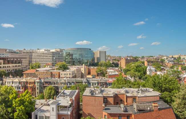 an aerial view of a city with buildings and trees