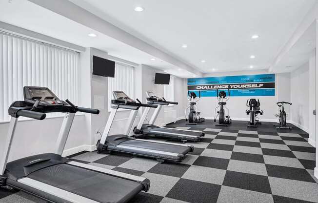 the gym is equipped with treadmills and exercise bikes