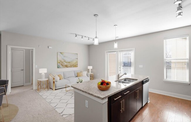 a kitchen and living room with a counter top
