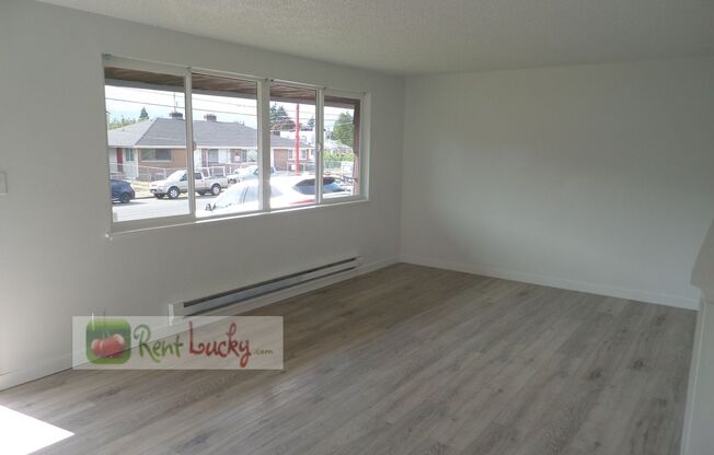 Super-Cute 2-Bedroom Home w/Attached Garage and Large Yard in Great Seattle Location!!