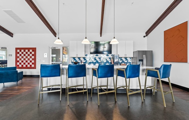 A dining room with a checkered red and white wallpaper on the wall.