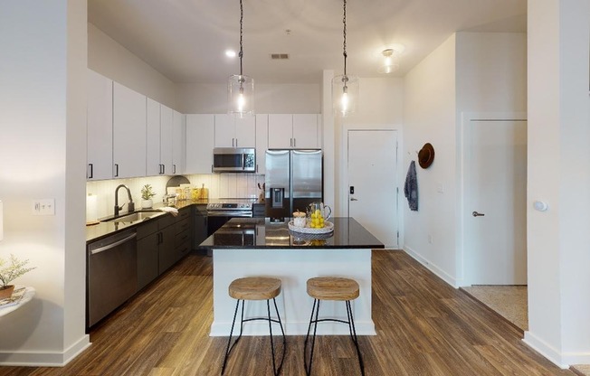 Open concept kitchen featuring granite countertops