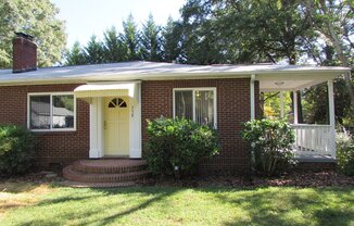Spacious 2 Bed/1 Bath Duplex - Updated - Fireplace - Covered Side Porch - Water/Sewer/Trash Included