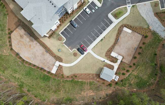 A red car is parked in a parking lot.