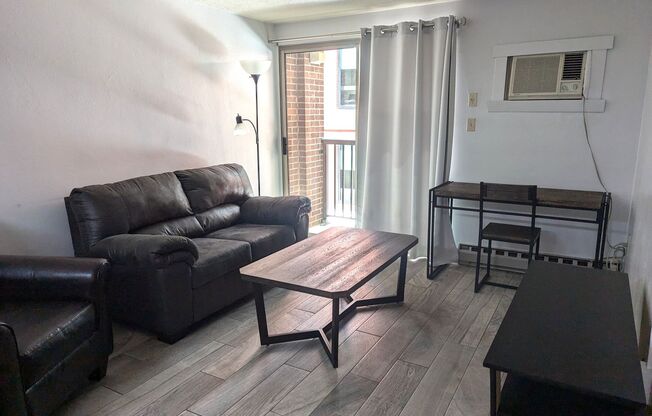 High Rise Living Directly Across the Street from Campus!