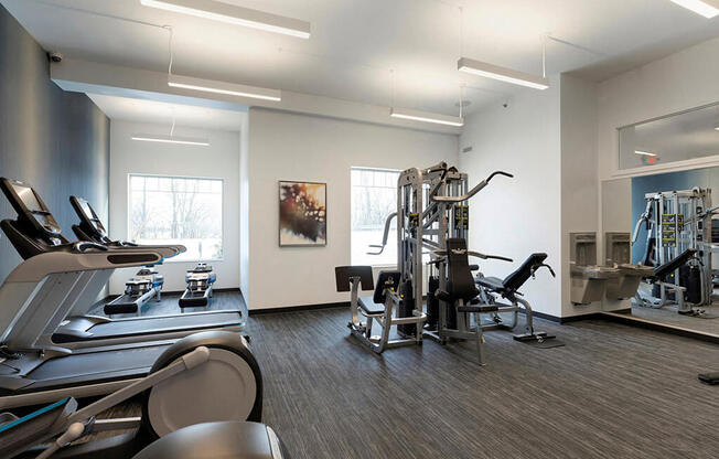 Multi-functional gym with 5 equipment stations for strength training at Waterstone Place in Minnetonka, MN