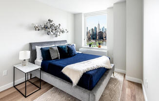 Bedroom with Manhattan skyline views. Apartment 3011.