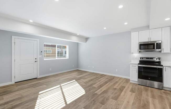 A kitchen with a stove top oven and microwave.