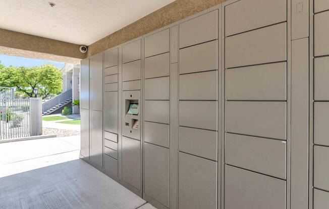 A row of lockers are lined up in a room.