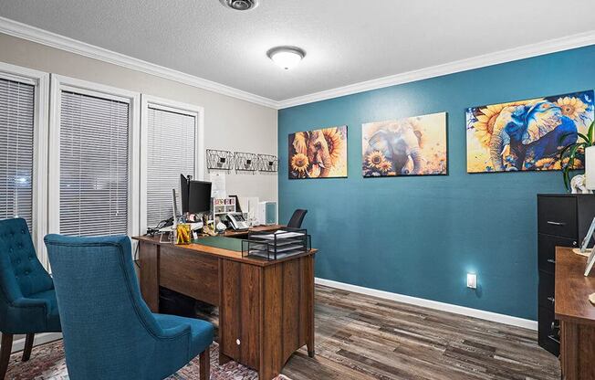 a home office with a desk and chairs
