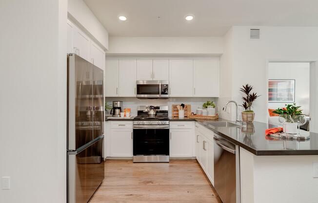 a stove top oven sitting inside of a kitchen