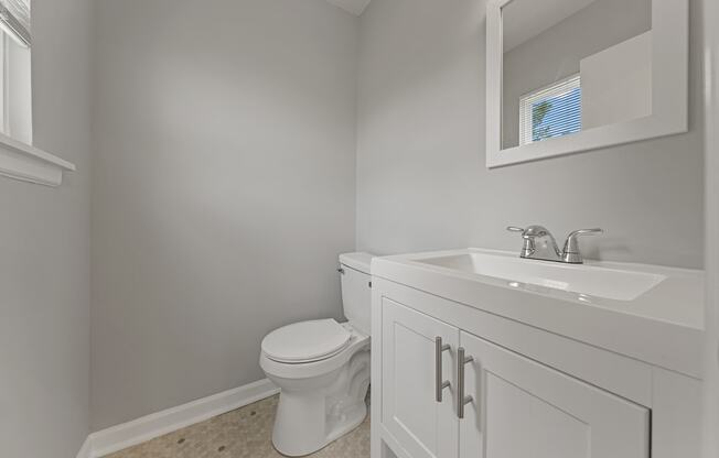 an empty bathroom with a toilet and a sink