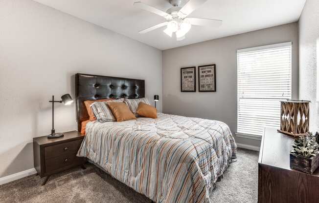 the preserve at ballantyne commons bedroom with bed and ceiling fan